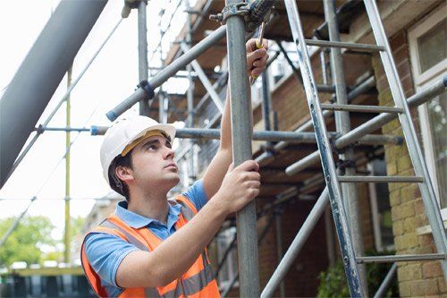 Constructor Putting Up Scaffolding