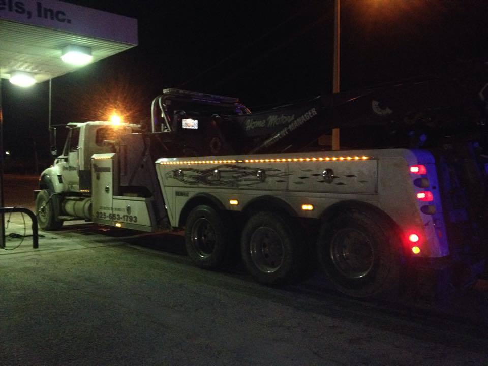 Home Motors, Inc tow truck service providing 24 hour towing service at night in Winters, TX