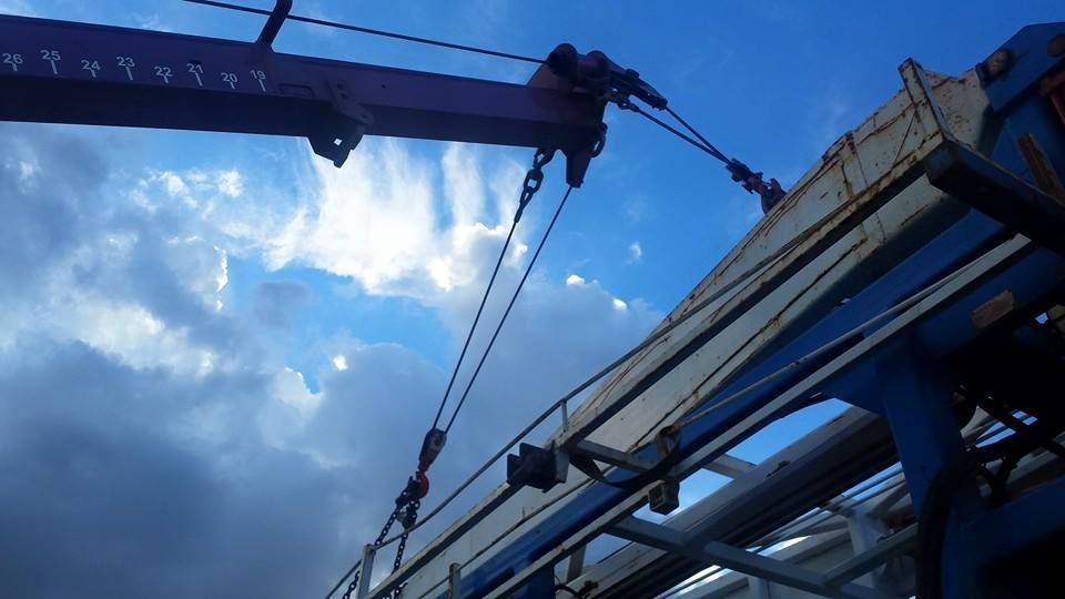 Close up of a Home Motors, Inc tow truck boom arm
