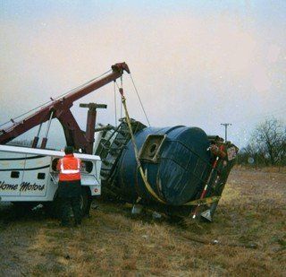 Towing company towing a large vehicle back to the road in San Angelo, TX