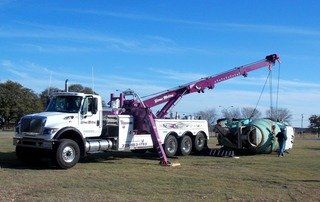 Home Motors, Inc fleet truck towing a cement truck for auto-accident recovery in Winters, TX