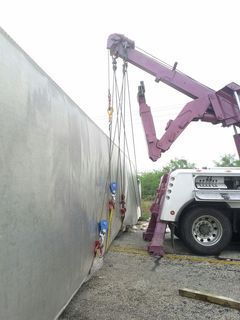 Towing company lifting a tractor-trailer in Big Lake, TX