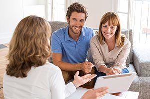 A Couple Discusing Management Services