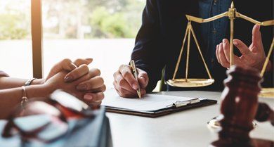 Attorney — Lawyer and a Client with Scale and Gavel in Schuylerville, NY