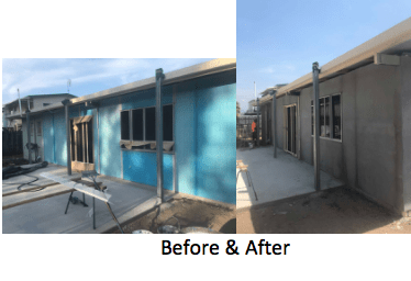 Building exterior renovation; before and after photos. The old blue facade is replaced with a gray, stucco finish.
