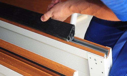 Major Brands — Repairman Replacing Door Panel in Birmingham, AL Major Brands — Repairman Replacing Door Panel in Birmingham, AL
