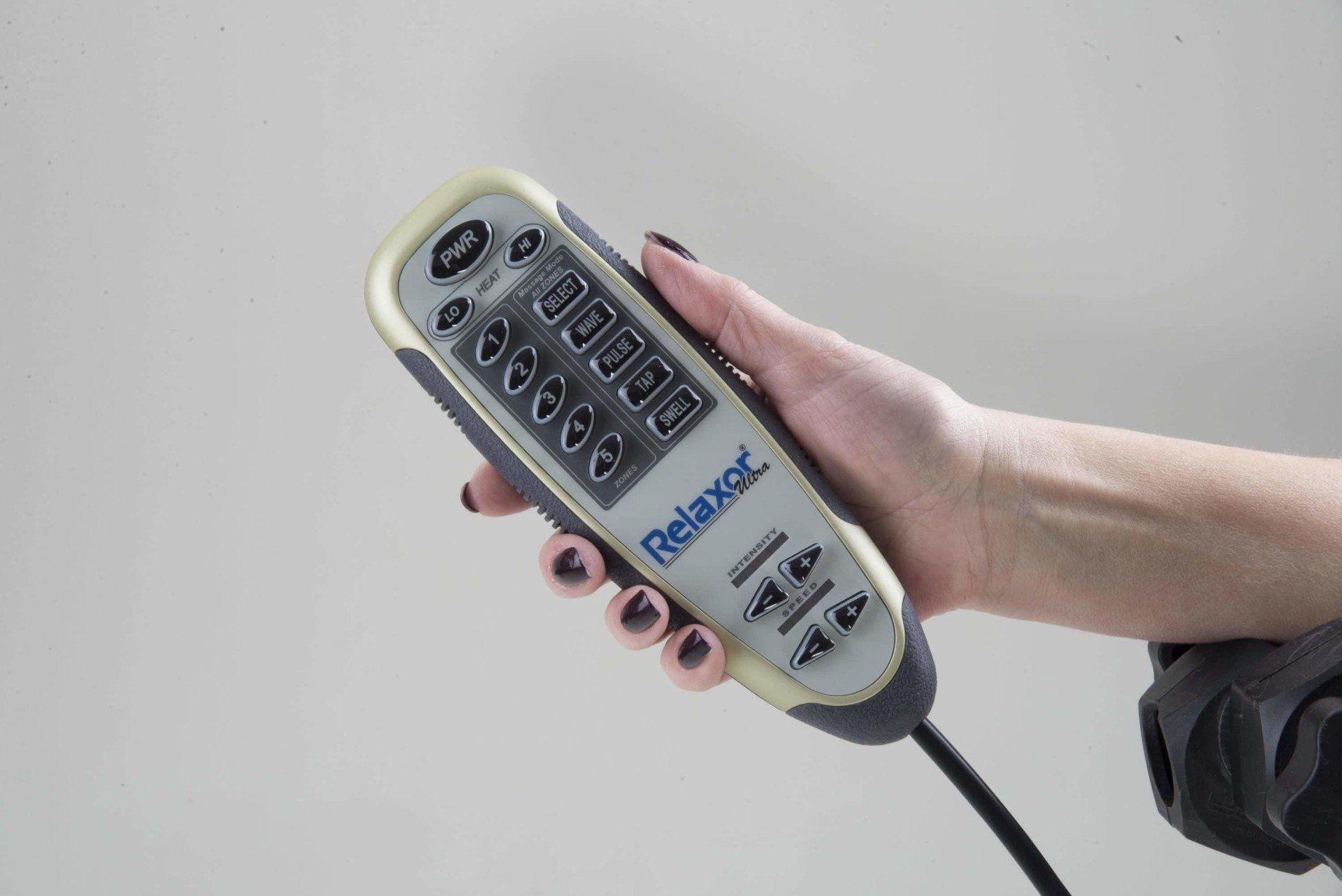 hand holding Heat & Massage Handset