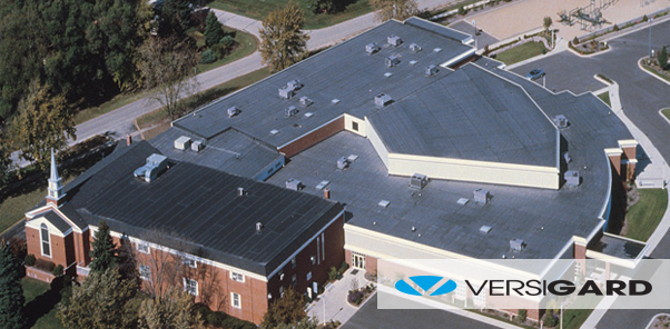 An aerial view of a large building with a Versigard logo on the bottom