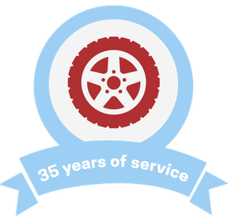 Round icon with red tire and a ribbon that says 