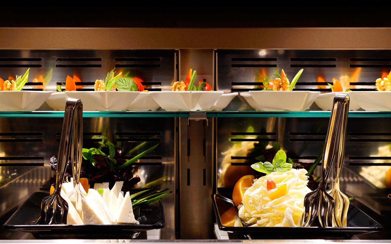 A refrigerator filled with a variety of food including noodles and vegetables