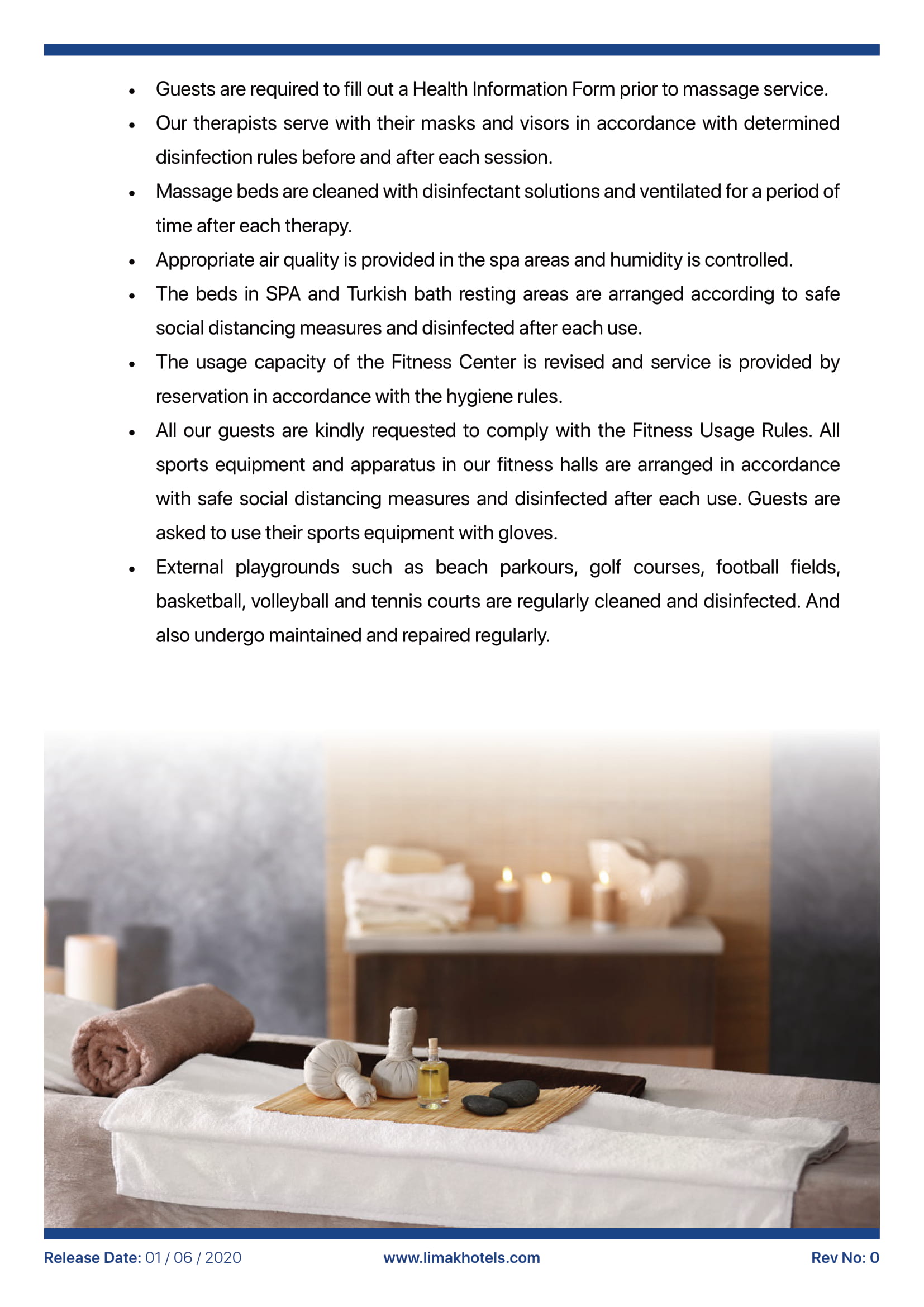 A table with towels and candles on it in a spa.