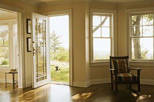 Door Repair Service — Man Fixing Door Lock in Port St Lucie, FL Door Repair Service — Man Fixing Door Lock in Port St Lucie, FL