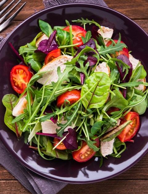 Fresh salad with chicken, tomatoes and mixed greens (arugula, mesclun, mache)