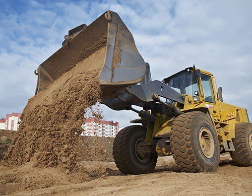 Excavating contractor hauling dirt materials in Batavia, NY