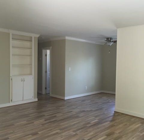 Apartment with hardwood floors and a ceiling fan