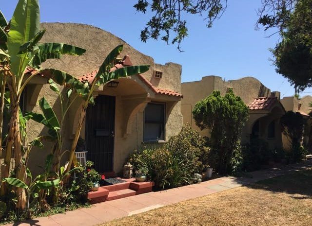 Spanish style houses in a row on a clear day
