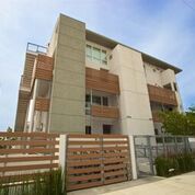 3 story apartment building with balconies