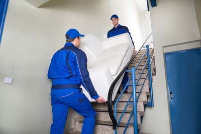 Movers Carrying Couch — Billings, MT — Aaron's Back Company Movers Carrying Couch — Billings, MT — Aaron's Back Company
