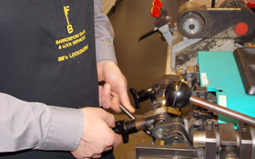 an expert key-cutter at work