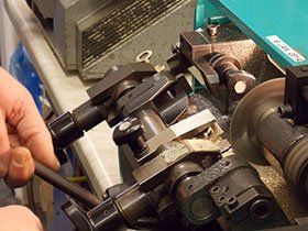 a professional key-cutter manufacturing a key
