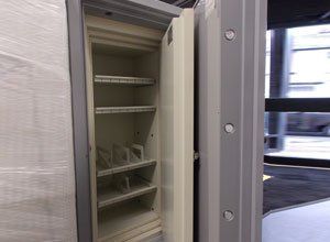 an empty safe with the door open