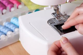 Threading a Needle in Sewing Machine — Bellflower, CA — A-Rodgers Vacuum & Sewing Threading a Needle in Sewing Machine — Bellflower, CA — A-Rodgers Vacuum & Sewing