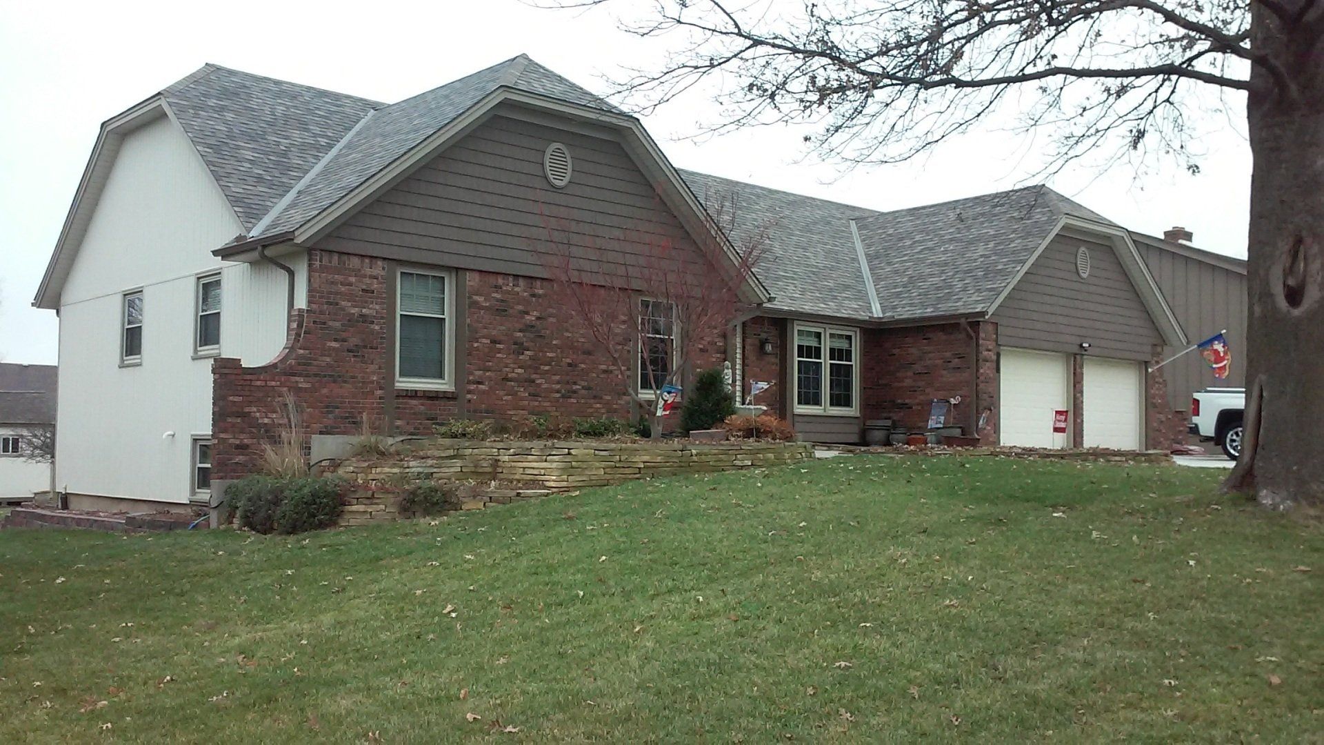 A large brick house with a gray roof