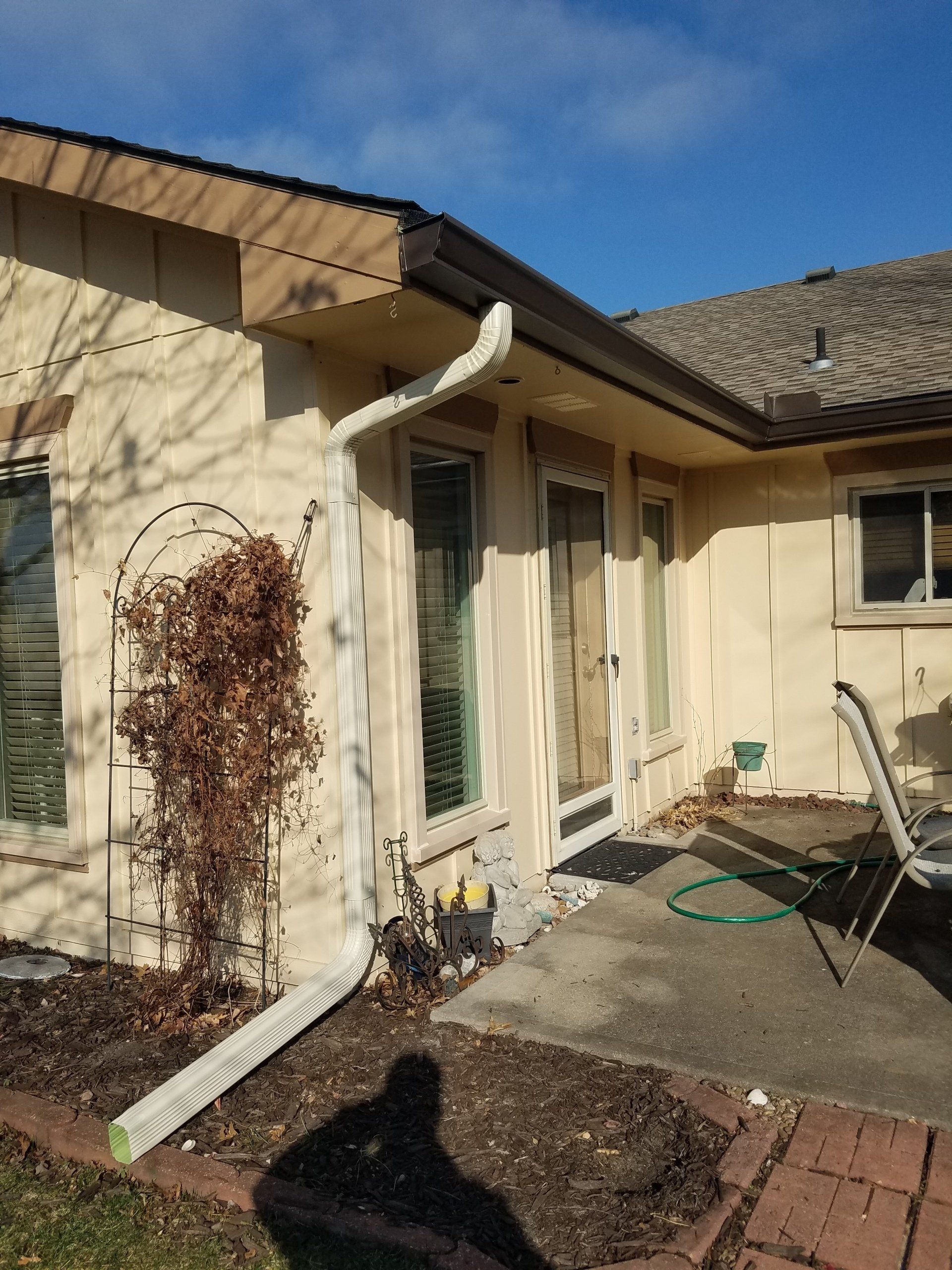 A house with a gutter on the side of it