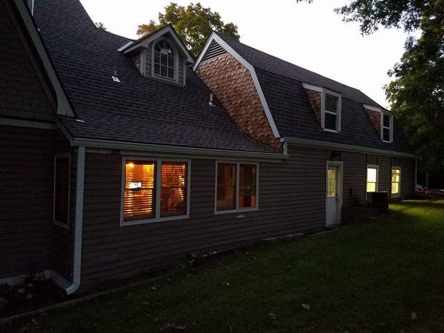 Cabin house roof shingles — Raymore, MO — Meissen & Sons Roofing