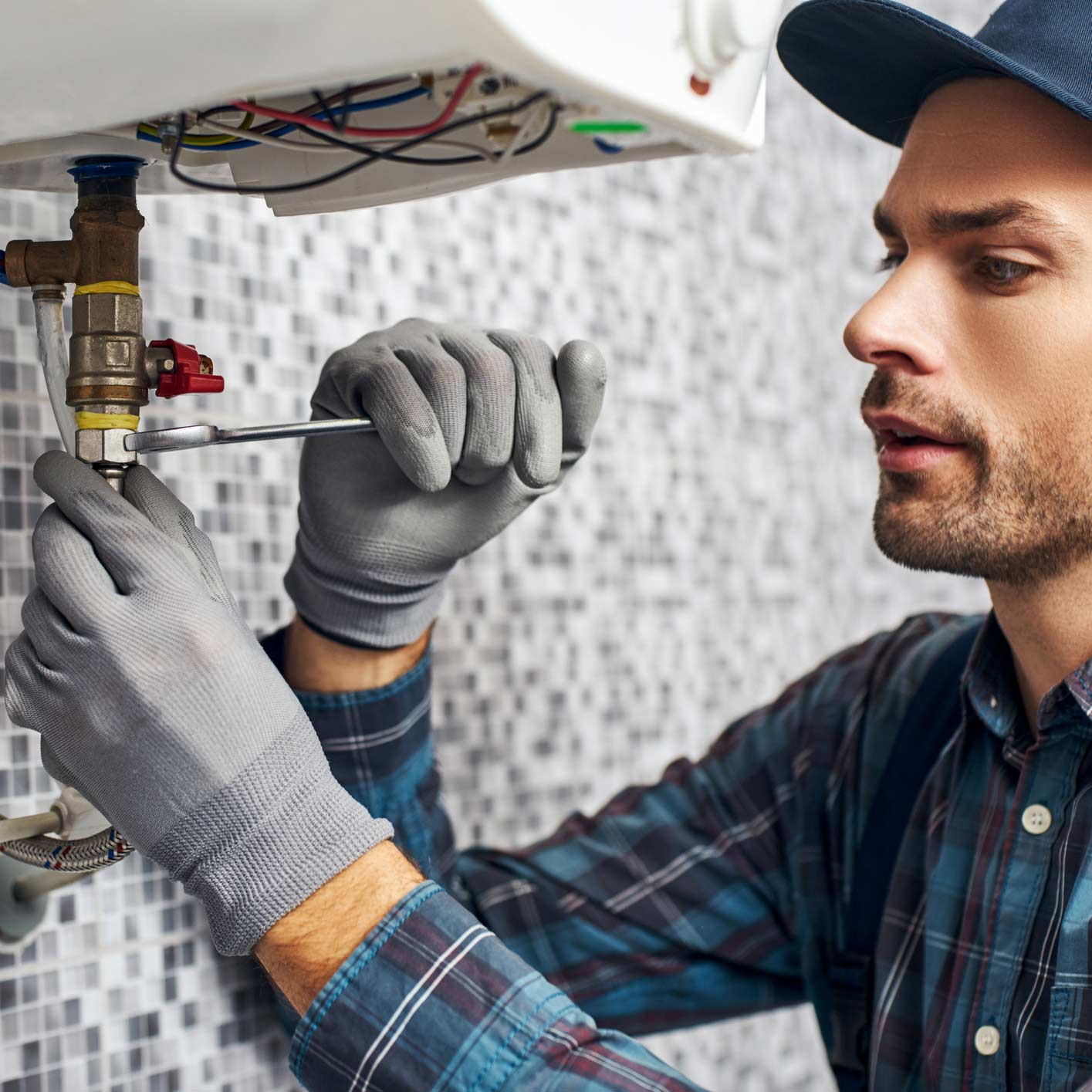 Plumber Fixing The Sink — Medford, OR — Cowboy Plumbing LLC Plumber Fixing The Sink — Medford, OR — Cowboy Plumbing LLC
