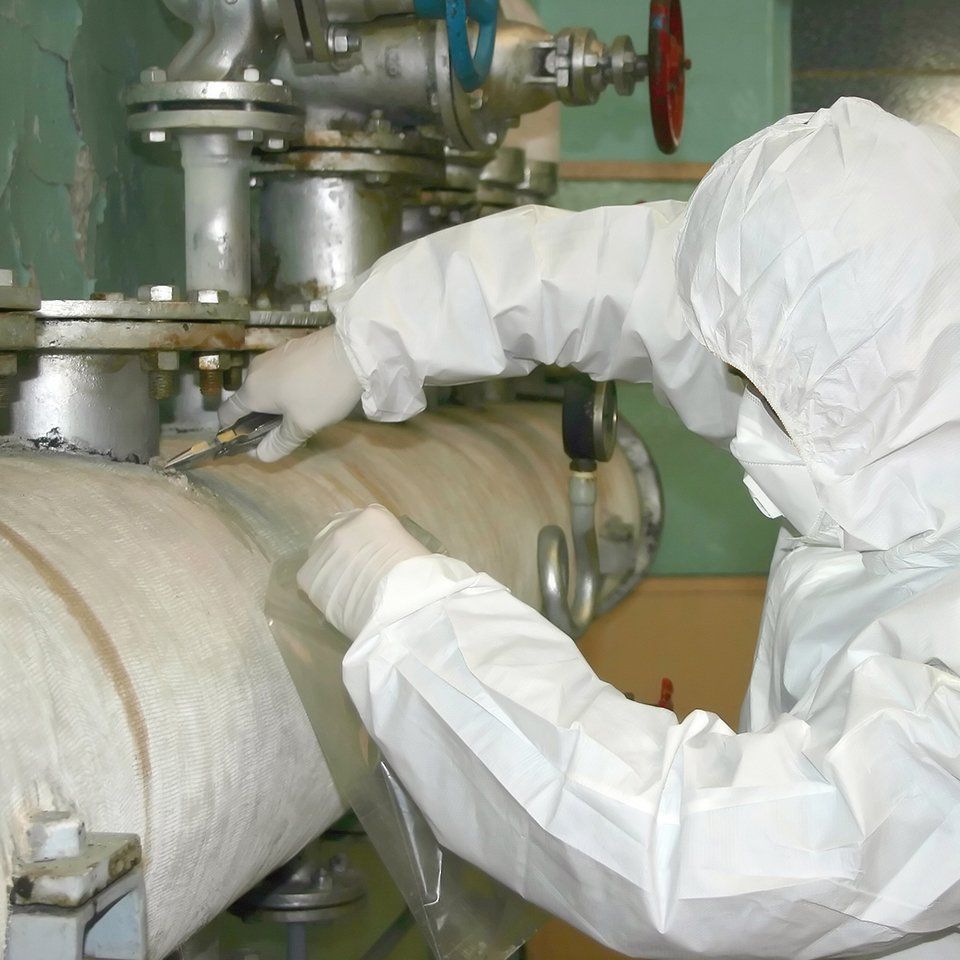 Person with Protective Suit Removing Asbestos — Oklahoma City, OK — Marshall Environmental Management
