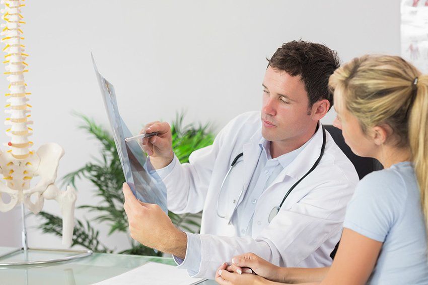 Doctor explaining the cray result to patient