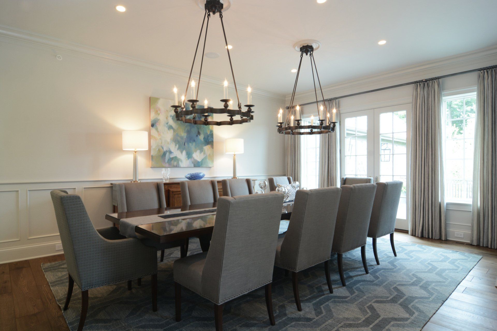 A large dining room with a long table and chairs