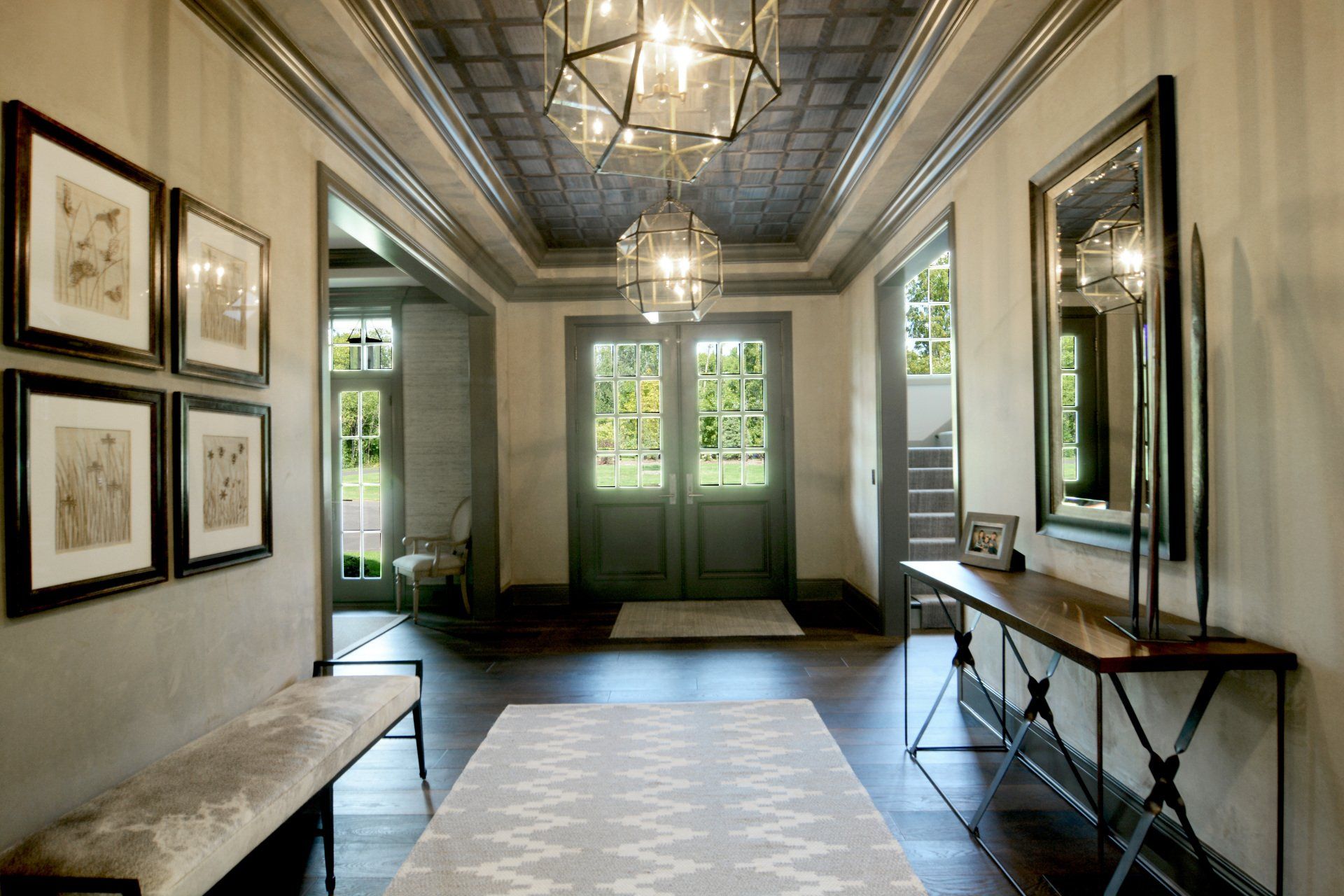 A hallway with a table and a bench in it