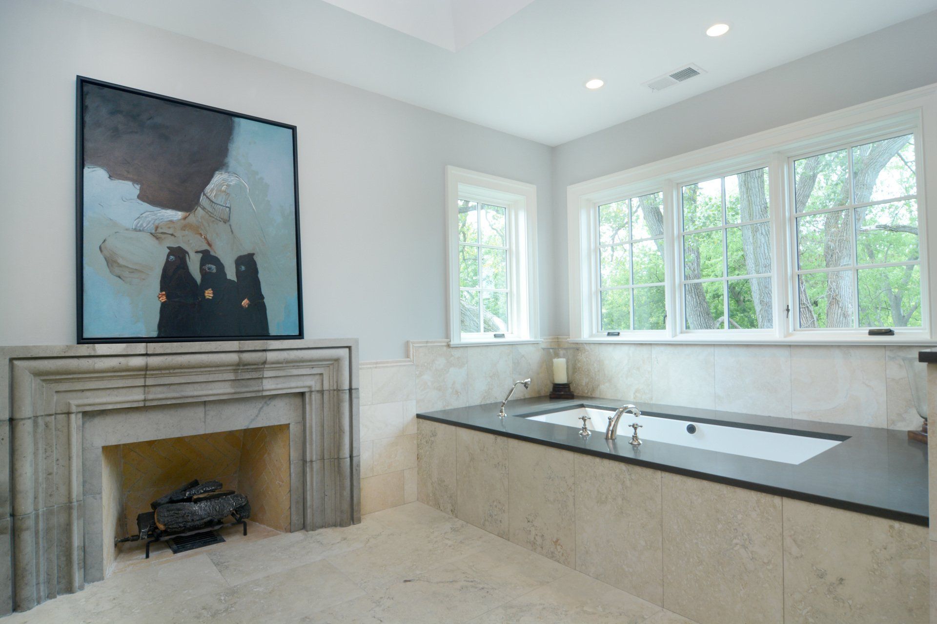 A bathroom with a fireplace and a bathtub