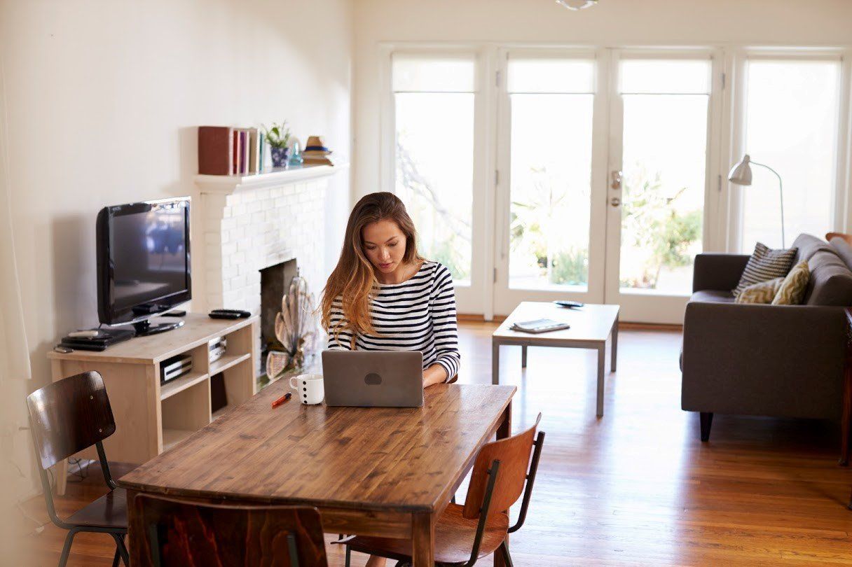 Woman with Laptop — Carpentersville, IL — Meadowdale Apartments Woman with Laptop — Carpentersville, IL — Meadowdale Apartments