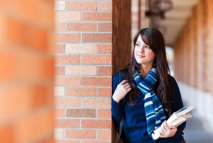 Woman holding a book — Carpentersville, IL — Meadowdale Apartments