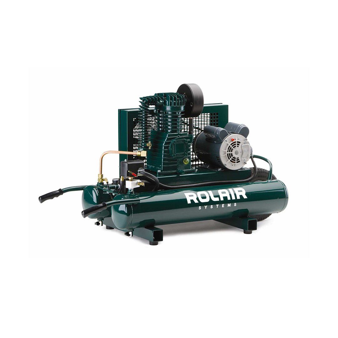 A green air compressor with a motor on a white background.
