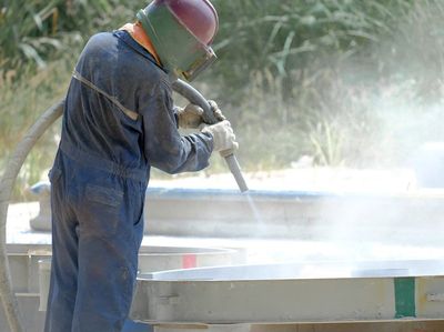 Man Doing Sandblasting — Rapid City, SD — Joe’s Sandblasting Equipment and Supply Man Doing Sandblasting — Rapid City, SD — Joe’s Sandblasting Equipment and Supply