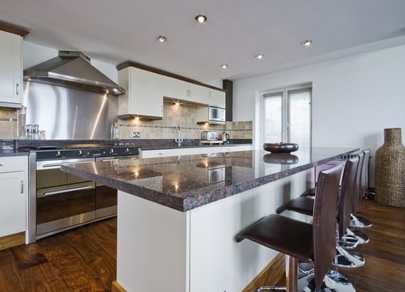 modern kitchen in white with wooden floor