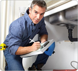Plumber examining water lines Plumber examining water lines
