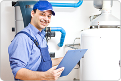 Man examining water heater