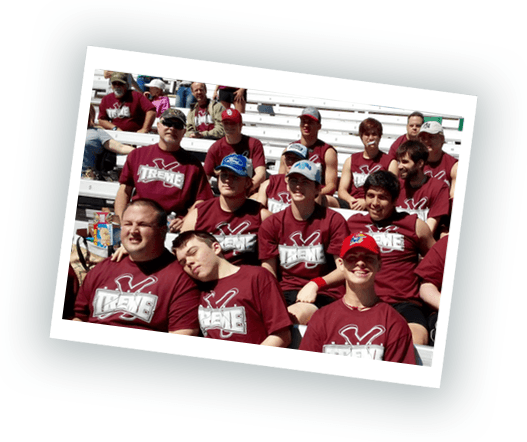 A group of people are sitting in a stadium wearing shirts that say treme.