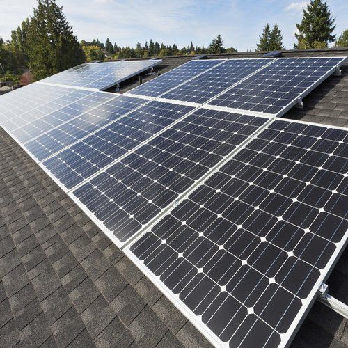 Solar panels fixed on the rooftop of a house