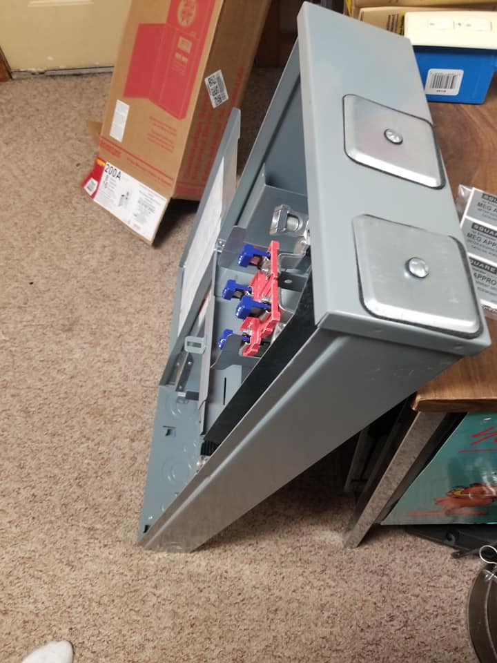 a box is sitting on the floor next to a table .