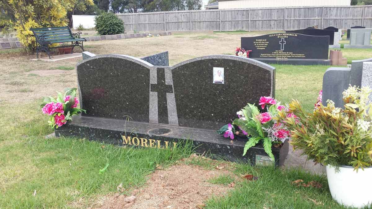 2 grey headstones