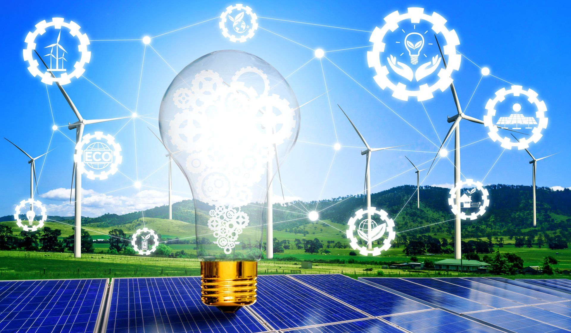 Solarmodule, Windturbinen und eine leuchtende Glühbirne stehen für Initiativen zur Förderung grüner Energie auf einem Feld.