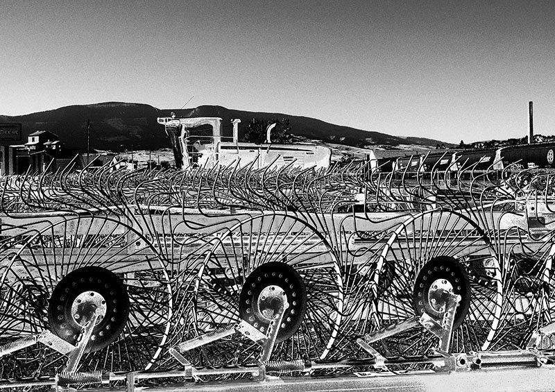 a composite image of a tractor and farm immplements created with computer manipulation.