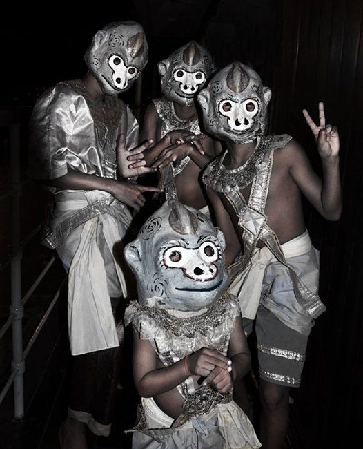 portrait of  Cambodian dancers wearing monkey masks.