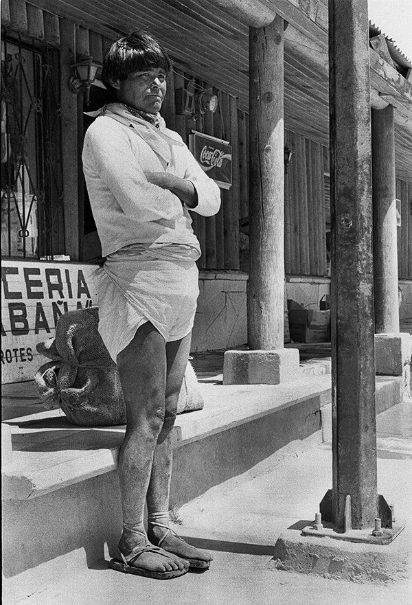 A documentary photo of a Tarahumara Inddian in traditional costume, Creel, Mexico.